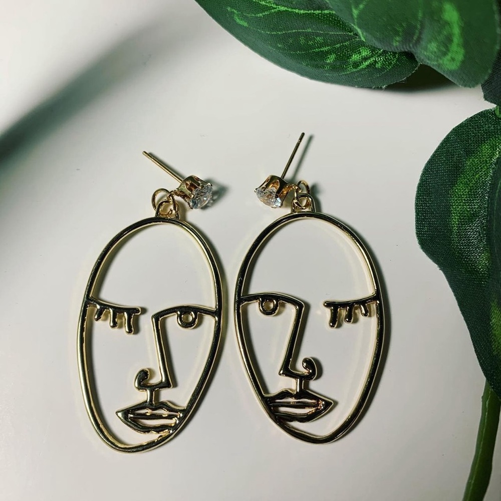 Brand new abstract face earrings